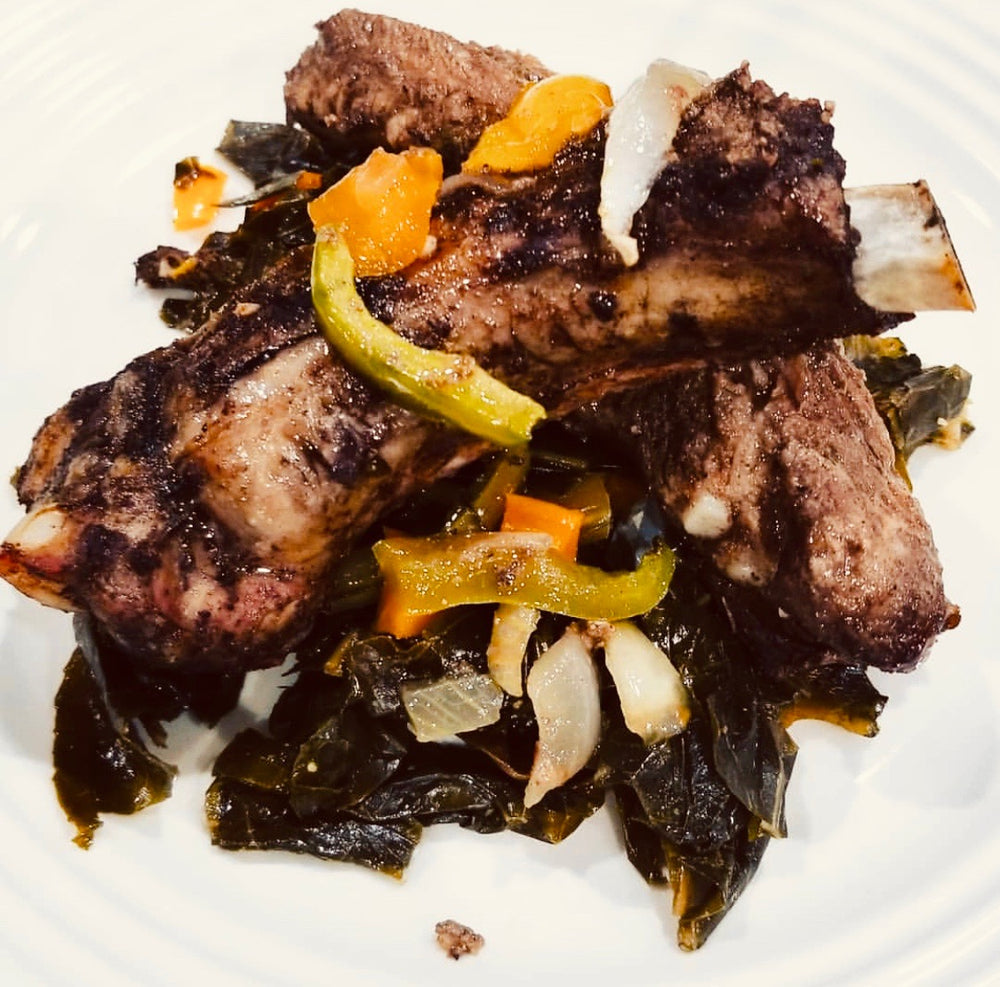 Braised Jerk Pork Ribs over a bed of Sautéed Kale